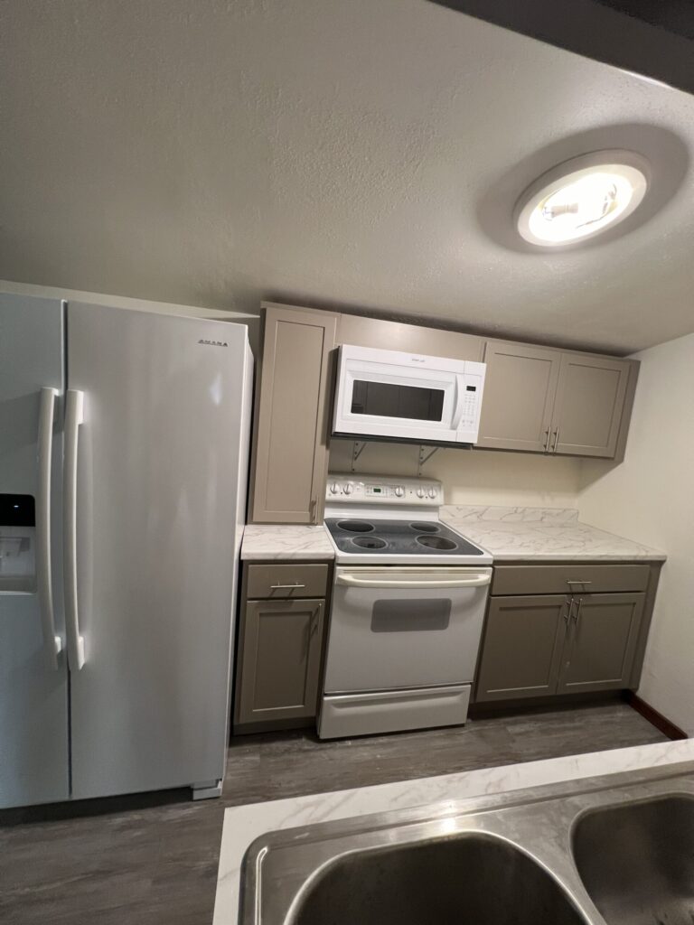 This image shows what the kitchen area looks like after remodeling has been done