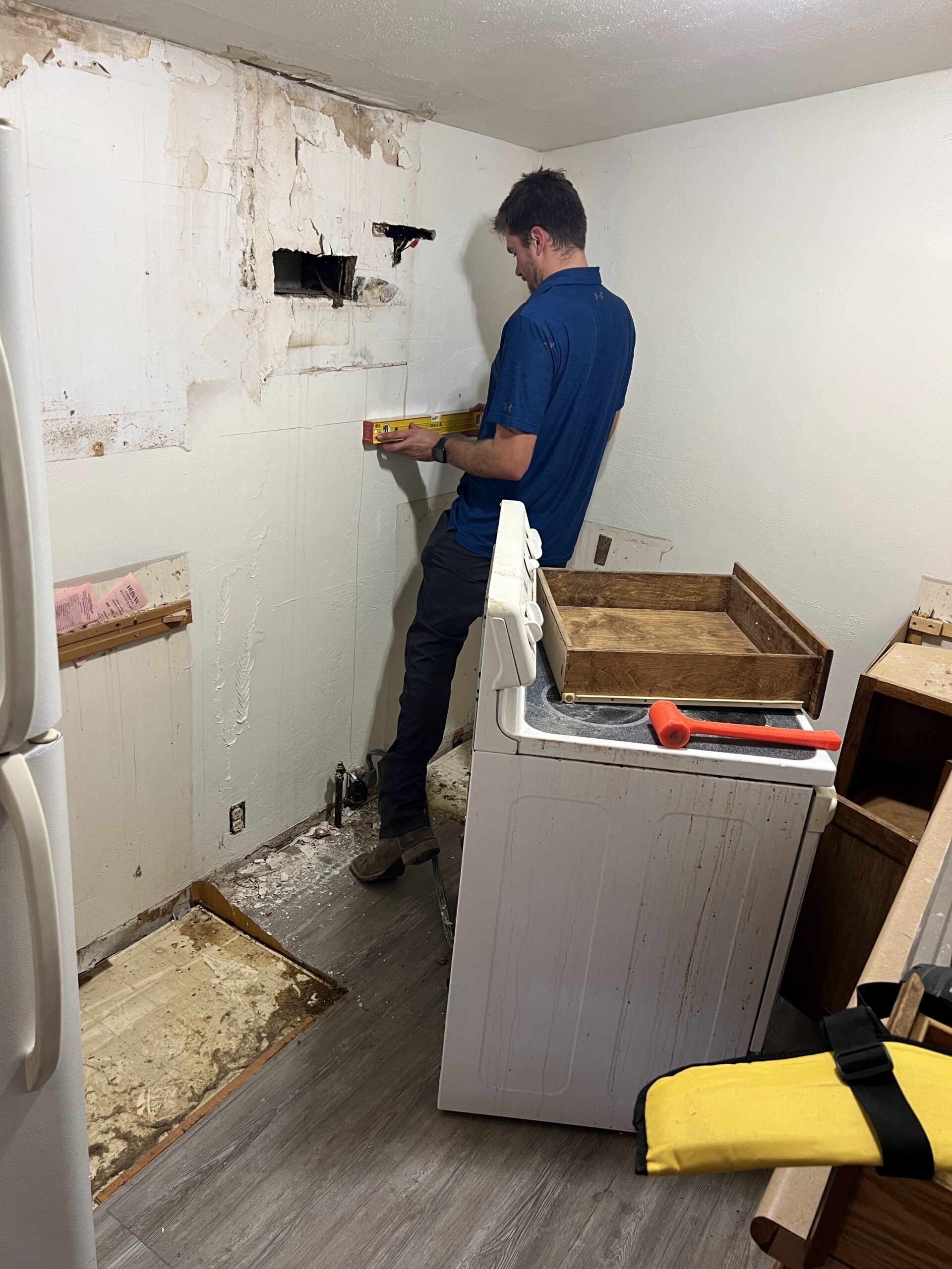 Blaine (owner) carefully checking the leveling work in a clients kitchen.